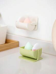 Caja de almacenamiento de motas, soporte giratorio montado en la pared para dividir las esponjas de maquillaje, cojín de aire no perforado, estante transpirable para huevos de belleza