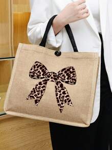 Un ensemble de sacs à main avec un imprimé léopard, un nœud et un motif de bande dessinée, fabriqué en lin jaune, comprenant un sac à main à boucle magnétique et une trousse de maquillage.