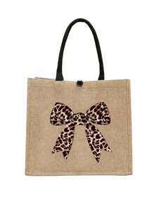 Un ensemble de sacs à main avec un imprimé léopard, un nœud et un motif de bande dessinée, fabriqué en lin jaune, comprenant un sac à main à boucle magnétique et une trousse de maquillage.