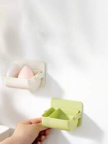 Caja de almacenamiento de motas, soporte giratorio montado en la pared para dividir las esponjas de maquillaje, cojín de aire no perforado, estante transpirable para huevos de belleza