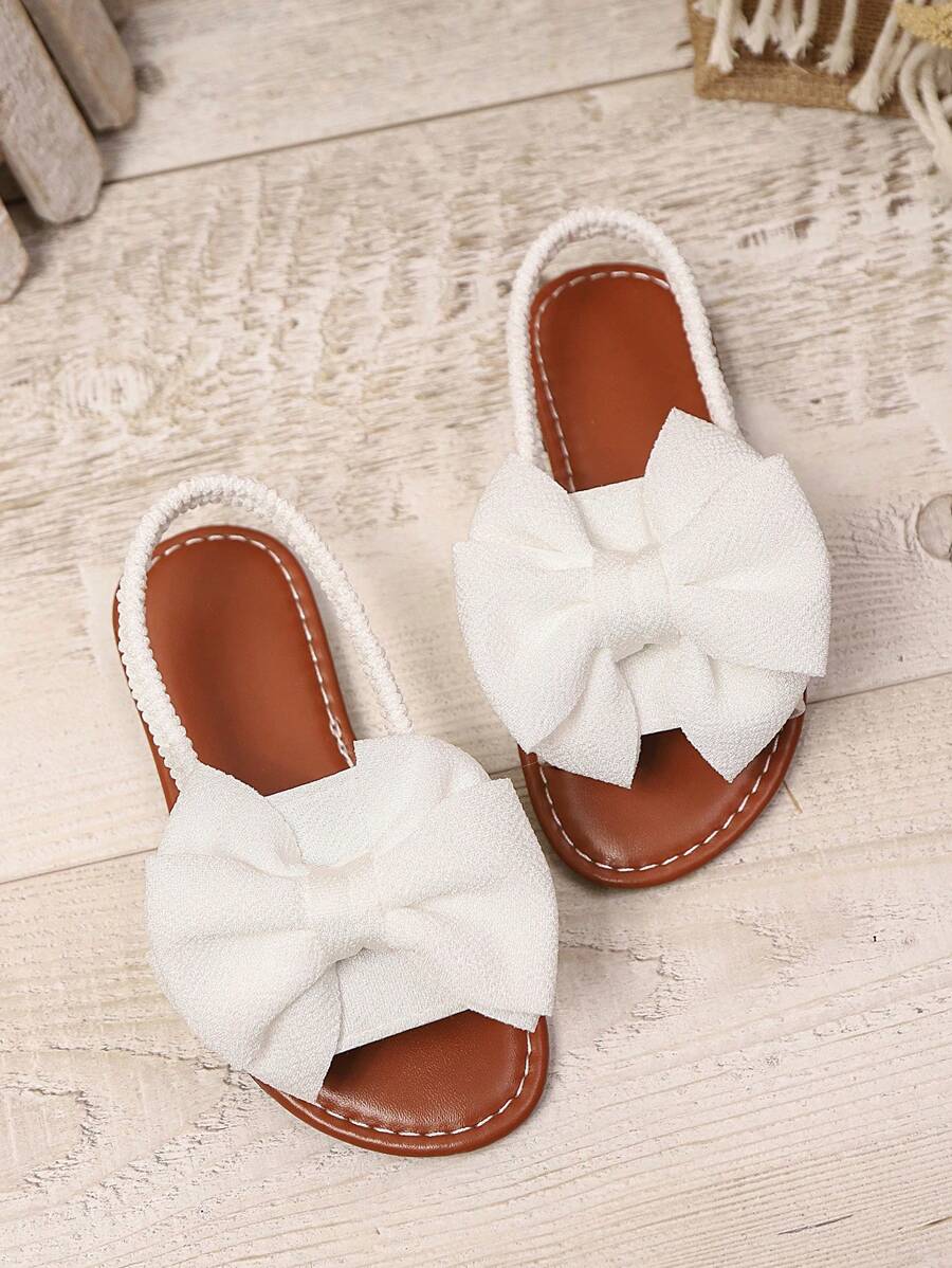 1 par de sandalias planas blancas de talla grande para niñas bebés/niñas pequeñas, con decoración de lazo de malla de unicolor, correa elástica en la parte trasera, punta redonda, suela antideslizante y ligera, estilo gladiador de moda para el verano, adecuadas para niñas de 3 a 15 años para uso diario, fiestas y viajes