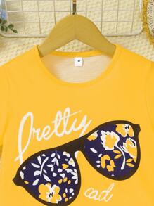 Set de 2 piezas de shorts y camiseta de manga corta para niñas con estampado de gafas y flores, apropiado para niñas de 3 a 7 años
