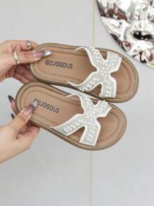 1 par de sandalias de dedo con tiras cruzadas decoradas con perlas y cristales para niñas/niños, color blanco - Beis - Ver 9