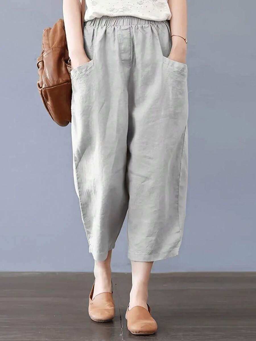 大码女式纯色休闲宽松七分裤，带大口袋