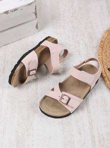 1 par de sandalias planas, anchas y de color rosa claro para niñas y niños pequeños, con correa de PU y hebilla metálica, diseño de correa con , punta redonda, antideslizante, de estilo romano, fashionables y lindas, para estudiantes de 3 a 15 años, uso diario, fiesta, casual, vacaciones, primavera/verano 2025