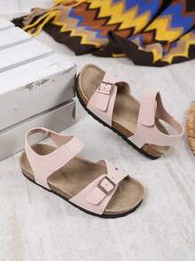 1 par de sandalias planas, anchas y de color rosa claro para niñas y niños pequeños, con correa de PU y hebilla metálica, diseño de correa con , punta redonda, antideslizante, de estilo romano, fashionables y lindas, para estudiantes de 3 a 15 años, uso diario, fiesta, casual, vacaciones, primavera/verano 2025