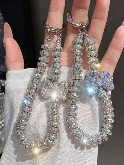 短款奢华水钻手链、蝴蝶结装饰手机挂绳、手机壳钥匙扣配件、优雅手提包吊饰，适合送给母亲、家人、朋友、生日、节日的手机吊饰、手机链