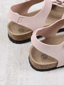1 par de sandalias planas, anchas y de color rosa claro para niñas y niños pequeños, con correa de PU y hebilla metálica, diseño de correa con , punta redonda, antideslizante, de estilo romano, fashionables y lindas, para estudiantes de 3 a 15 años, uso diario, fiesta, casual, vacaciones, primavera/verano 2025