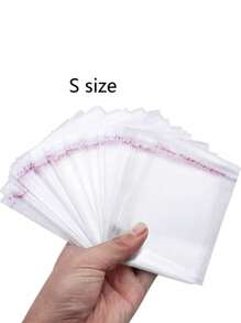 100 Pcs Self-Adhesive Sealing Clear Opp Bags, Resealable Plastic Bags For Large-Scale Packaging Of Small Gifts, Party Favors, And Toys,Suitable For Items Of Different Sizes, S/M/L/Xl, Can Be Used For Clothes, Shirts, Pants, Food, Paint, Party Gifts Packaging,Solid Packaging Bags