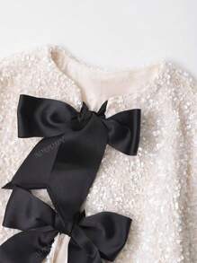 Veste courte pour femme avec décoration de nœud scintillante