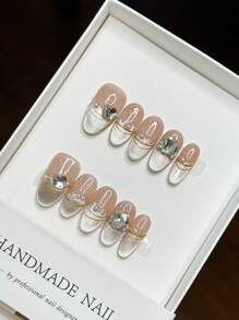 Accesorios para uñas: Nuevo diseño de primavera con ojos de gato, perlas, lazos y piedras preciosas. Uñas postizas de estilo adhesivo.