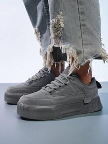 Zapatillas deportivas de skate minimalistas de color gris puro con lazo frontal para mujeres, de punta redonda, con suela elevada, versátiles para uso casual diario y actividades al aire libre