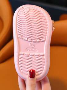 A Pair Of Summer New Fashionable And Comfortable EVA Children's Perforated Shoes With Breathable And Lightweight Features, Anti Slip And Odor Resistant, And Cartoon Decoration Design