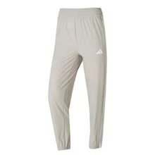 Adidas TE 3S WOVEN PT 女褲 運動褲跑步健身訓練褲透氣休閒褲長褲 JD6522 - 淺卡其色 - 查看 1