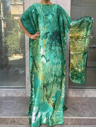 Une robe longue à manches longues avec imprimé floral pour femme grande taille, avec un foulard. Élégante avec col rond et manches chauve-souris, jupe longue ample en polyester. Convient pour toutes les saisons, idéale pour les fêtes, modeste.
