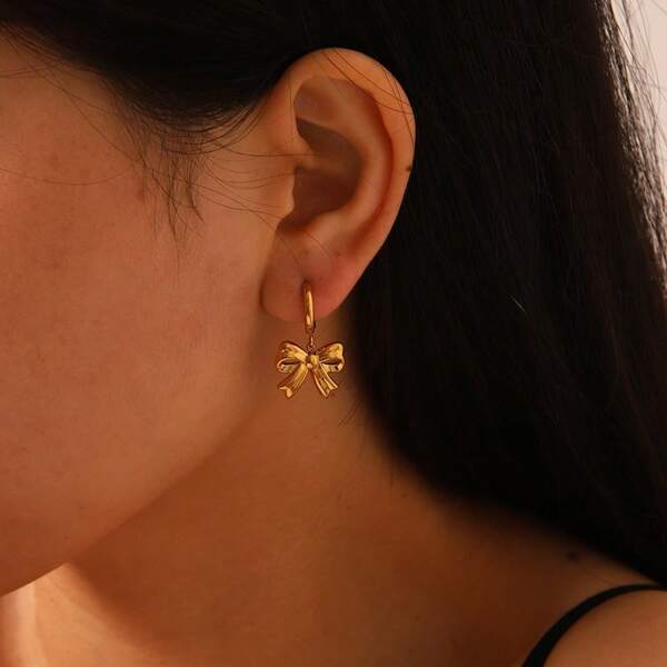 1 par de elegantes pendientes de aro con diseño de lazo dulce de acero inoxidable, pendientes de mujer de diseño geométrico único de moda