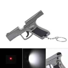Pistola de juguete mini tres en uno multifuncional con láser rojo, silbato y llavero, más linterna. - luz blanca - Ver 1