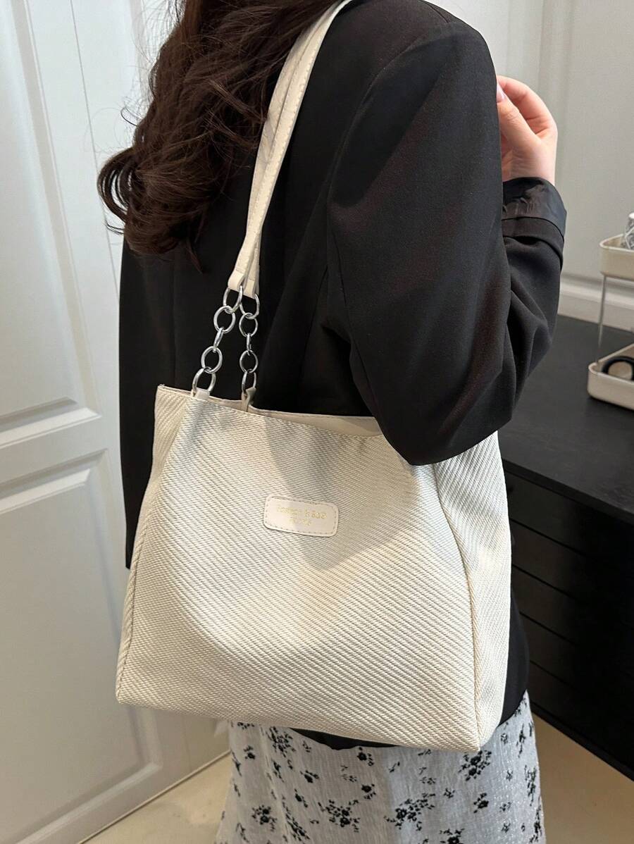 Bolso de hombro tipo tote con múltiples bolsillos en unicolor y cadena