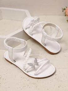 1双白色加大码女童时尚凉鞋，纯色PU编织带，闪亮彩色蝴蝶装饰，弹性踝带，圆头露趾，平底防滑舒适优雅可爱罗马凉鞋，适合3-15岁女孩，日常、休闲、派对、旅行皆宜，2026春夏款 - 白色 - 查看 2