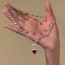 1 pieza Collar con forma de corazón rojo de lujo con perla falsa y diseño de cadena ósea de alta gama para mujeres