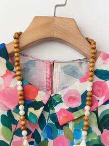 Camicetta con scollo a V con stampa floreale in poliestere per donna, con fessura, stampa all-over globale