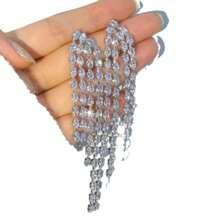 1 par de pendientes largos con borlas de aleación de cobre exagerada con circonita, adecuados para usar en fiestas y vacaciones de mujeres