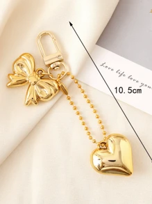 1 pieza Llavero con forma de corazón, moño, diseño hueco de estrella de 5 puntas, colgante para teléfono móvil, accesorio para coche, bolso, mochila para la escuela, accesorio creativo para mujer