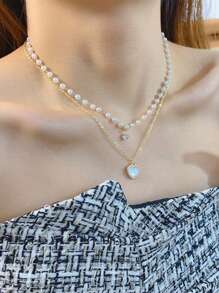 1 件双层流苏和珍珠山茶花项链