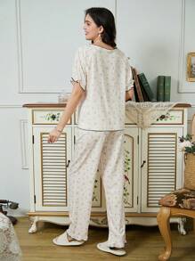 Pijama de 2 piezas conjunto de blusa de manga corta con estampado floral rojo y pantalón largo, blanco, con lazo, volantes en mangas y cuello cuadrado
