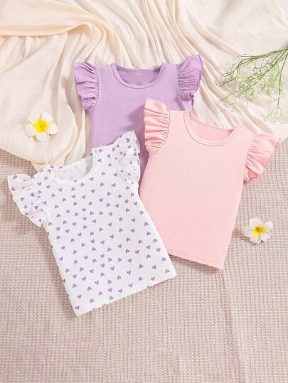 Set de 3 camisetas con mangas abullonadas y estampado de corazón para niñas pequeñas, con diseño adorable de corazón y volantes, que les dan un aspecto dulce y juguetón. Disponible en morado, rosa y blanco, versátil y fácil de usar, adecuado para uso diario, jardín de infantes, actividades de padres e hijos, etc. Tela suave y transpirable, cómoda y no calurosa, permitiendo que las niñas pequeñas jueguen libremente, ¡dulce y con estilo!