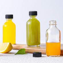 10 sztuk 2 Oz 60ml Mała przezroczysta szklana butelka z pokrywkami, puste pojemniki na napoje wielokrotnego użytku do soku, imbiru, olejków eterycznych, butelki na wodę do użytku na zewnątrz, do uprawiania sportu