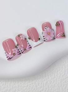 10 pièces Ensemble de faux ongles à motif de canard Y2K - Faits à la main, style French tips roses, finition brillante avec rayures zébrées noires françaises, fleurs 3D faites à la main, ornements de fleurs rouges et accents de strass dorés étincelants - Parfait pour les fêtes et les tenues décontractées, parfait pour la vie quotidienne et les tenues de fête. Fournitures pour faux ongles, excellent cadeau pour les femmes et les filles, comprend un kit d'outils
