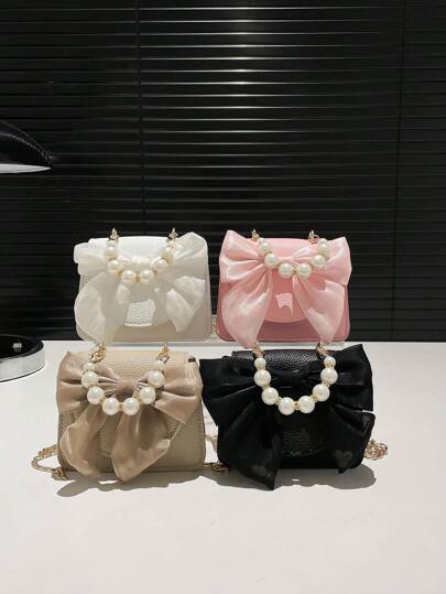 This Fashionable And Versatile Cute Bow Pearl Handbag/Shoulder Bag Features A Stylish Chain Strap And Flap Magnetic Closure, Decorated With A Bow And Pearls, Sweet And Adorable, Full Of Girlish Charm. Suitable For Girls Shopping, Daily Use, Attending Parties, And Also An Excellent Gift For Little Girls.