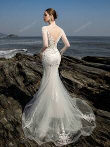 Vestido de novia sirena con entrenada, mangas largas, corset bordado con cuentas lujoso y noble de HEARBOBO para la novia