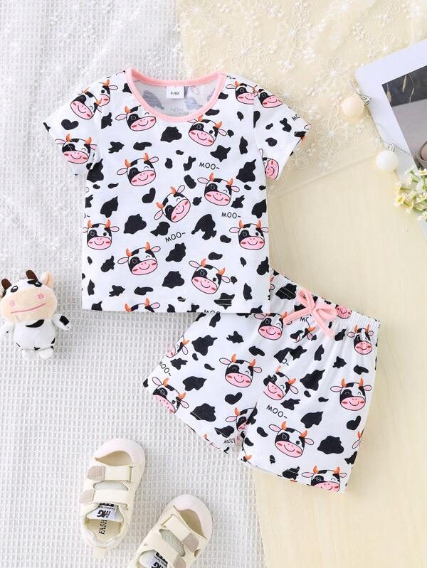 Set de 2 piezas de camiseta de manga corta con cuello redondo y estampado de vaca informal y tierno, y pantalones cortos con moño para niñas, ropa infantil de verano