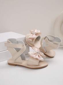 1 paire de sandales plates pour filles, de couleur unie avec des fleurs de marguerite, décor de fausses perles, PU antidérapant, confortable, de luxe, à la mode, bout rond, avec une bride à scratch, sandales casual adaptées aux activités extérieures, printemps/été 2025