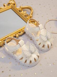 Sandálias fofas para bebês, estilo coreano, sola macia, antiderrapante, bico fechado, sapatos de princesa com laço para meninas pequenas