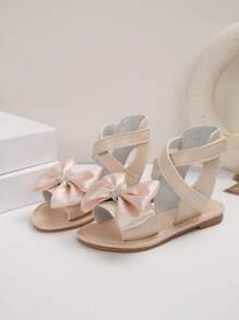 1 paire de sandales plates pour filles, de couleur unie avec des fleurs de marguerite, décor de fausses perles, PU antidérapant, confortable, de luxe, à la mode, bout rond, avec une bride à scratch, sandales casual adaptées aux activités extérieures, printemps/été 2025