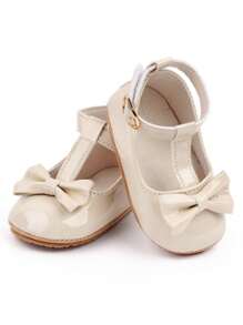 أحذية بنفلات لطفلة باللون المشمشي، أحذية أميرة للفتيات، جلدية مزينة بفيونكة ، قاعدة لينة مقاومة للانزلاق، أحذية مشي لحديثي الولادة