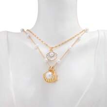 2 Stücke Sommer Halsketten Set, Strand Halskette für Frauen, verstellbare mehrlagige Halskette mit Kunstmuschel- und Kunstperlendesign. Nicht fixierte Sommer Ozean Halskette