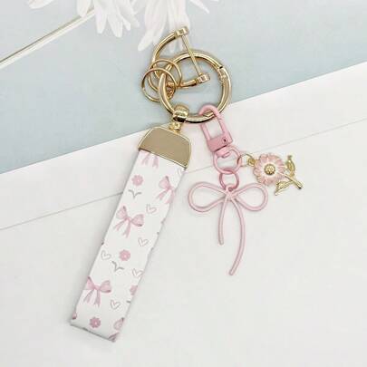 Inicia tu viaje afortunado: El lazo floral simboliza la suerte y la belleza. Que este llavero inicie tu viaje afortunado.
