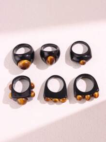 Bague large asymétrique en résine noire avec un motif géométrique de faux œil de tigre rétro. Bijou empilable de mode européenne et américaine pour femme. Excellent cadeau pour les amis.