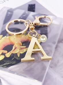 这款高级优雅的金色字母钥匙扣，A-Z 3D字母吊坠，时尚合金材质，饰以珍珠，可作包包、背包、汽车钥匙链，是女士的完美配饰，也是情侣的绝佳礼物。经典简约的钥匙扣，既可作装饰品，也可作包包配饰，适合赠送给朋友、家人、情侣、女友，也是一份重要的礼物和节日纪念品。 - 金色 - 查看 6