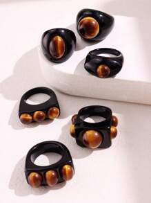 Bague large asymétrique en résine noire avec un motif géométrique de faux œil de tigre rétro. Bijou empilable de mode européenne et américaine pour femme. Excellent cadeau pour les amis.