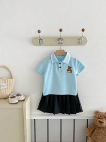 女童学院风卡通 Polo 衫和百褶裙套装，开学季