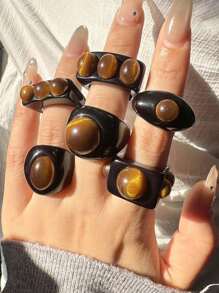 Bague large asymétrique en résine noire avec un motif géométrique de faux œil de tigre rétro. Bijou empilable de mode européenne et américaine pour femme. Excellent cadeau pour les amis.