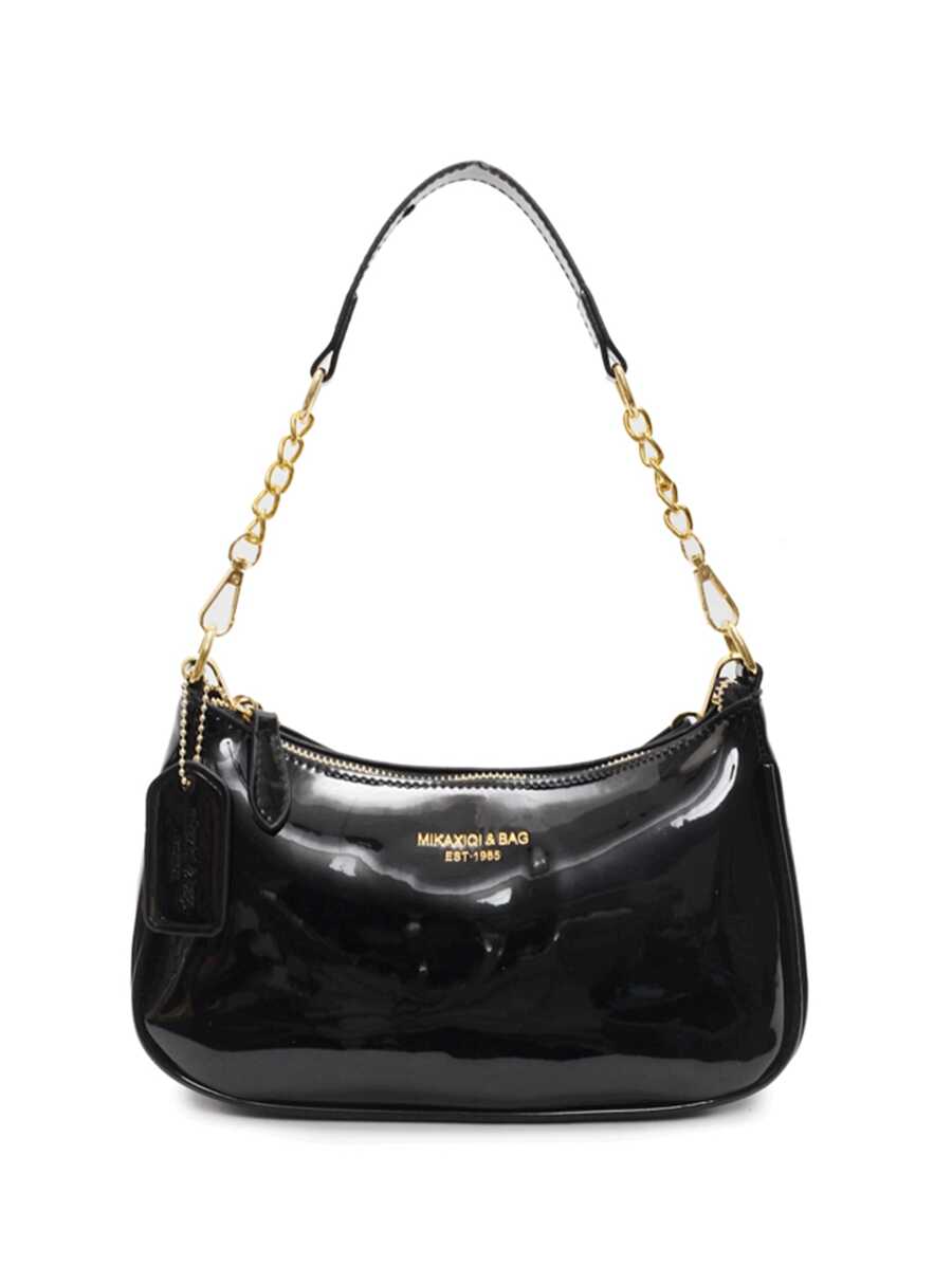 La nueva bolsa de hombro en forma de media luna de diseño clásico y silvestre, con patrón de letras decorativas y unicolor de tela impermeable de PU, adecuada para ir de compras y puede llevarse colgada.