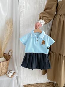 女童学院风卡通 Polo 衫和百褶裙套装，开学季