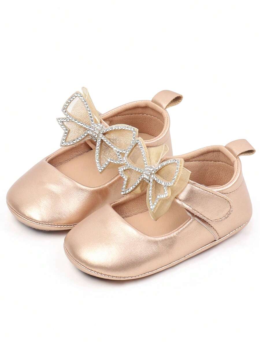 1 par de zapatitos de bebé, diseño lindo de lazo de dibujos animados, apropiado para interiores y exteriores con suela antideslizante para aprender a caminar, zapatos planos y suaves para bebés. - Dorado - Ver 1