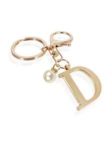 这款高级优雅的金色字母钥匙扣，A-Z 3D字母吊坠，时尚合金材质，饰以珍珠，可作包包、背包、汽车钥匙链，是女士的完美配饰，也是情侣的绝佳礼物。经典简约的钥匙扣，既可作装饰品，也可作包包配饰，适合赠送给朋友、家人、情侣、女友，也是一份重要的礼物和节日纪念品。 - 金色 - 查看 32